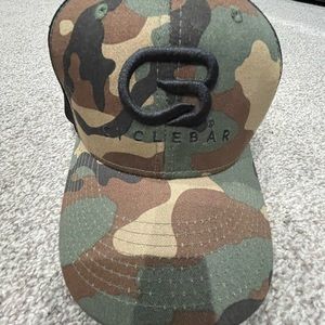 Army green and black Cyclebar trucker hat with adjustable strap for head size